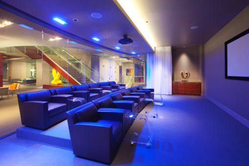 Theater and viewing room with purple lighting  at 1600 Glenarm Place, Colorado
