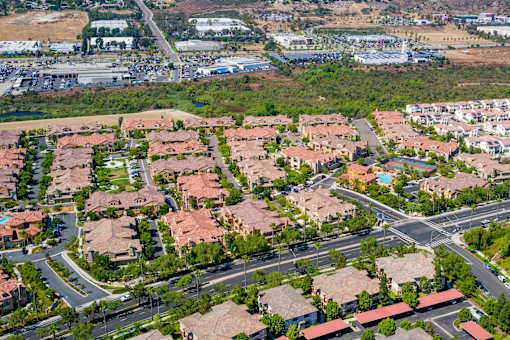 A suburban neighborhood with houses and streets.