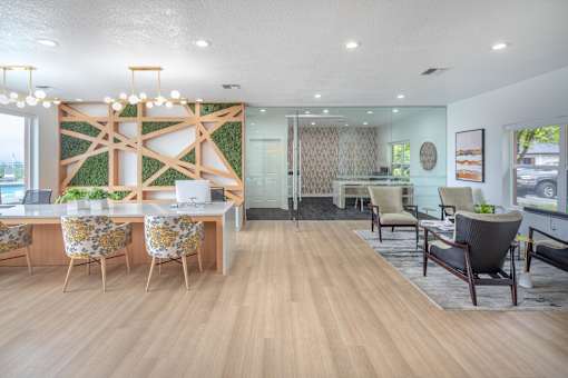A modern office space with wooden floors and furniture.
