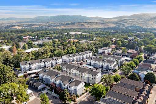 A bird's eye view of a residential area with houses and trees.