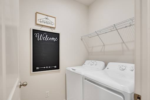 A laundry room with a washer and dryer