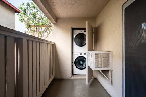 A small room with a washing machine and dryer.