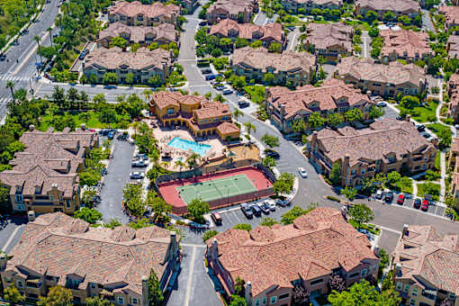 A residential area with houses and a pool.