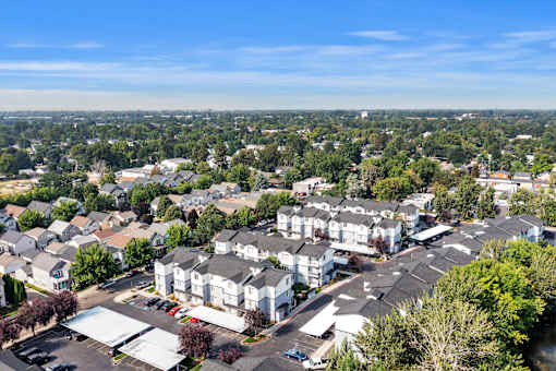 A bird's eye view of a residential area with houses and buildings.