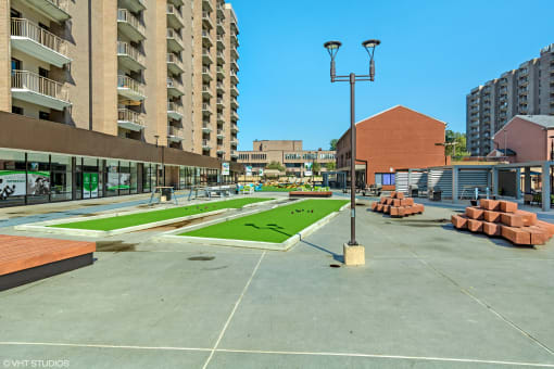 a park with artificial grass and benches at the casey lofts apartments in dallas,