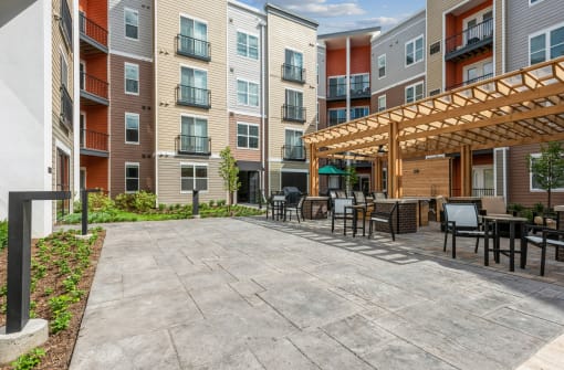 our apartments have a large patio with tables and chairs
