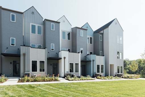 A modern building with grey and white exterior and multiple windows.at The Yarra, Madison, 37115