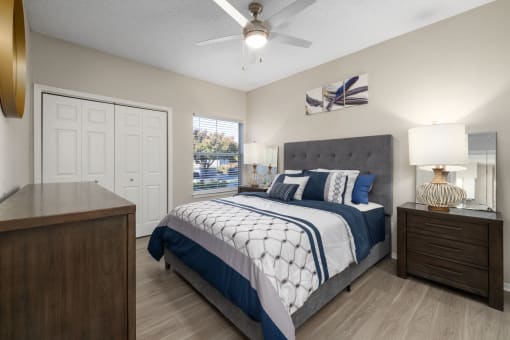 spacious bedroom with ceiling fan