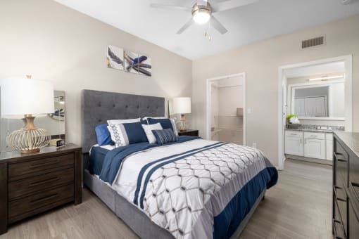 a spacious bedroom that connects to the bathroom