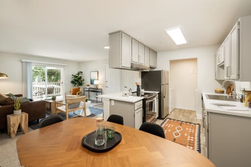 Open floor plan with kitchen and living area at Canyon Creek Apartments, Oregon
