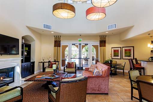 Clubhouse with couches and dining, fireplace