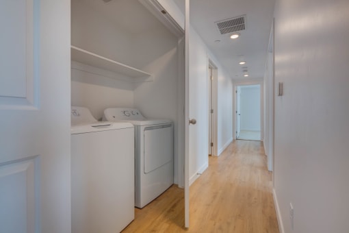 a laundry room with a washer and dryer