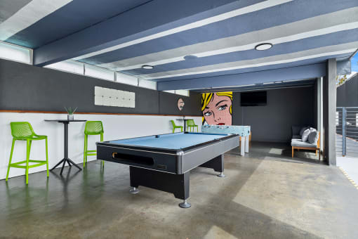 a game room with a pool table and a ping pong table at Milano Apartments, Torrance, CA, 90503