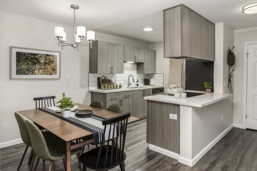 Kitchen and dining area with modern finishes at Canyon Creek Apartments, Wilsonville, 97070