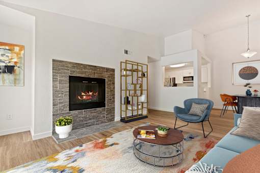 A living room with a fireplace and a chair.