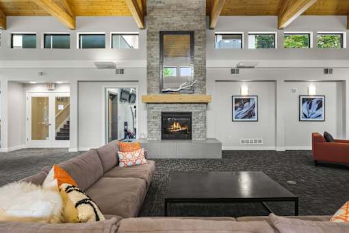 A living room with a fireplace and a couch.