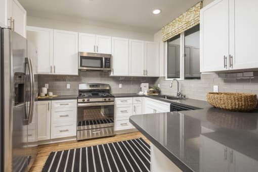 kitchen with cabinets  at Sorano Apartments