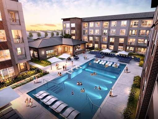 Overhead view of a group of people in a pool at Autry at Legacy apartments in Propser, TX.