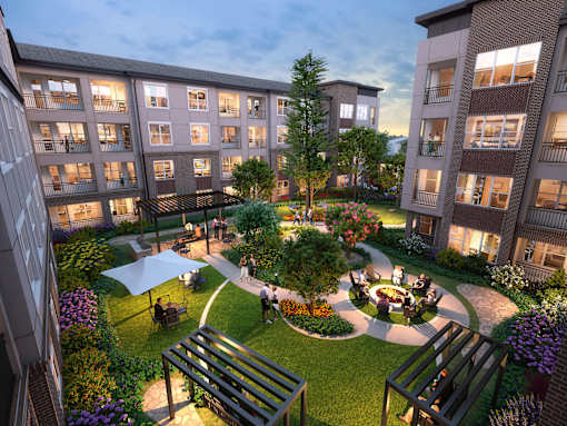 Outdoor courtyard with greenery and firepit at Autry at Legacy apartments for rent in Prosper, TX.