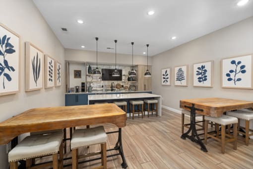 kitchen with tables, chairs and a TV