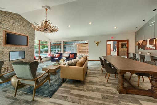 Clubhouse dining and lounge area with antler chandelier at Canyon Creek Apartments, Oregon