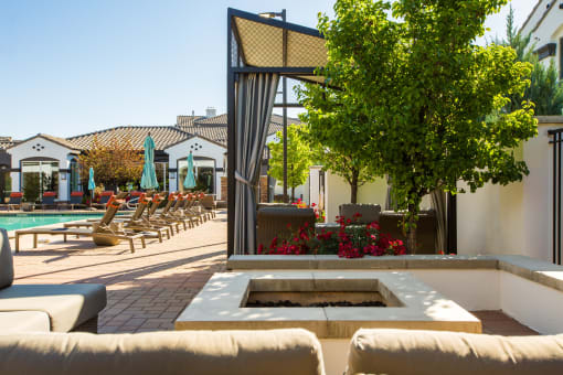Outdoor Lounge With Firepit at SkyStone Apartments, Albuquerque