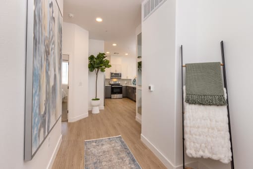 model apartment entry with wood like plank flooring at Element 12 Apartments, Henderson NV