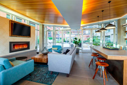 Club Room With Large Screen Tvs And A Fireplace at Equinox, Washington