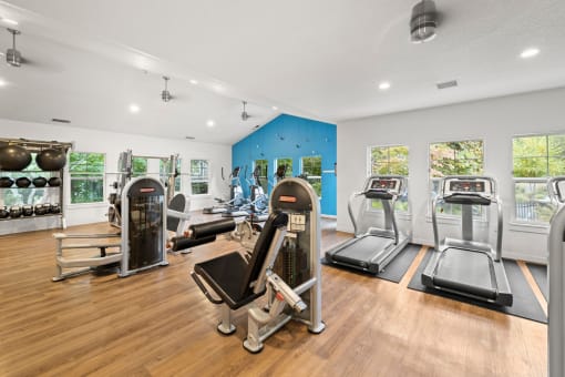 Fitness center with cardio and strength equipment at Canyon Creek Apartments, Oregon, 97070
