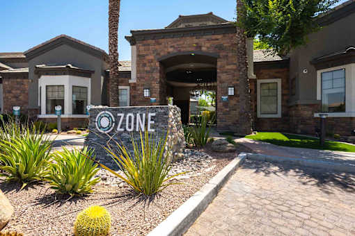 A sign in front of a house entrance says