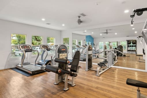 Gym with weight machines and cardio equipment at Canyon Creek Apartments, Wilsonville, 97070