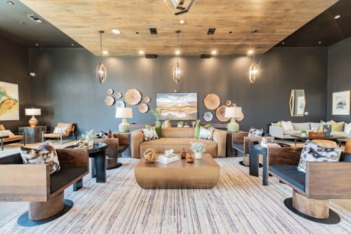 a living room with couches and chairs and a table