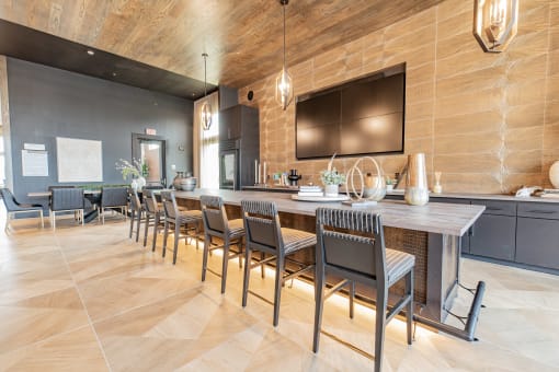 a large kitchen with a long table and chairs