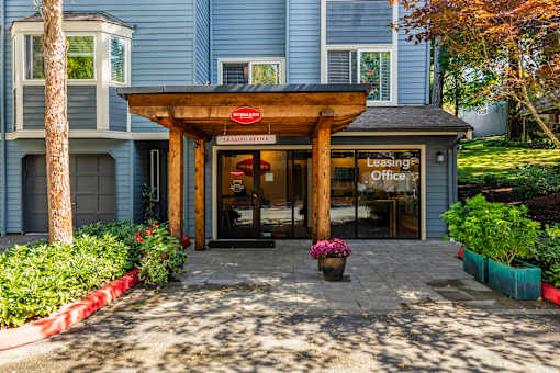 Leasing office entrance with covered portico at Hubbard's Crossing Apartments, Kirkland, WA