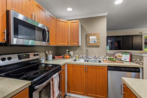 Kitchen with stainless steel appliances at Hubbard's Crossing Apartments, Kirkland