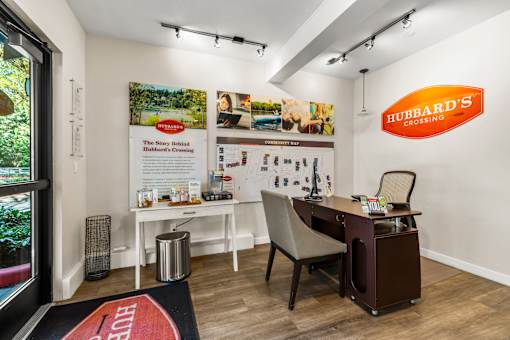 Leasing office interior with desk and community map at Hubbard's Crossing Apartments, Washington, 98034