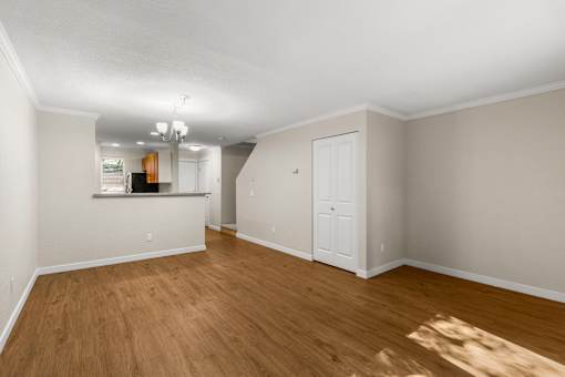 Open living and dining area with wood flooring at Hubbard's Crossing Apartments, Kirkland, 98034