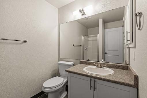 Bathroom with vanity and shower combination at Hubbard's Crossing Apartments, Washington