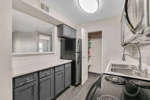 Kitchen with stainless steel appliances, LED lighting, Cabinet space