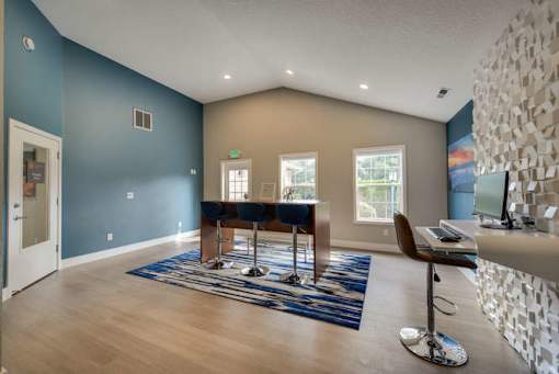 A room with a blue wall and a white ceiling.