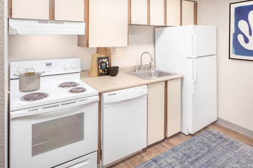 Kitchen With White Cabinetry And Appliances at Veri at Timberhill, Corvallis