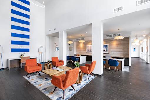 A modern living room with a blue and white striped wall.
