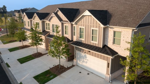 an aerial view of a row of houses with garage doors