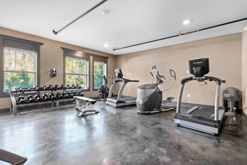 Fitness center with various pieces of equipment and weights