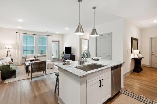 an open kitchen and living room with a counter top