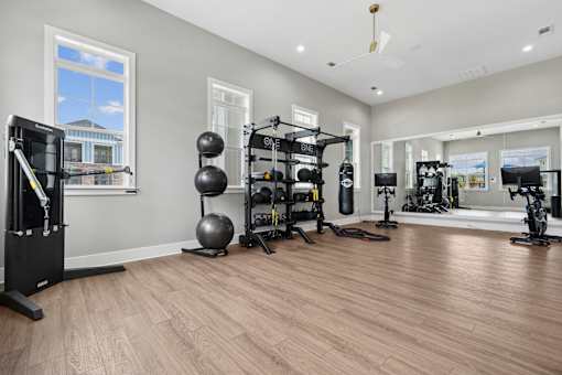 A well-equipped home gym with a variety of exercise equipment.