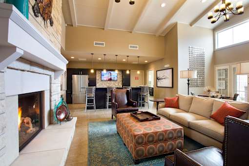 A living room with a fireplace and a couch.