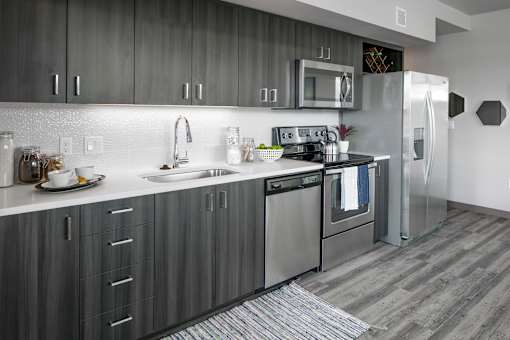 A modern kitchen with a stainless steel refrigerator