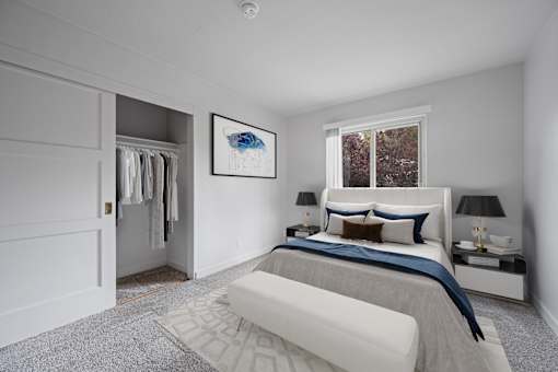 San Mateo, CA Pet-Friendly Affordable Apartments - Hillsdale Garden - Bedroom with Plush Carpeting, a Spacious Closet, and an Oversized Window