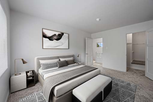 A modern bedroom with a large bed and a painting on the wall at Hillsdale Garden Apartments, San Mateo